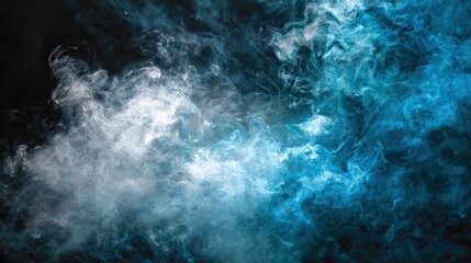Fototapeta premium Wisps of blue and white smoke swirl against a deep black background.
