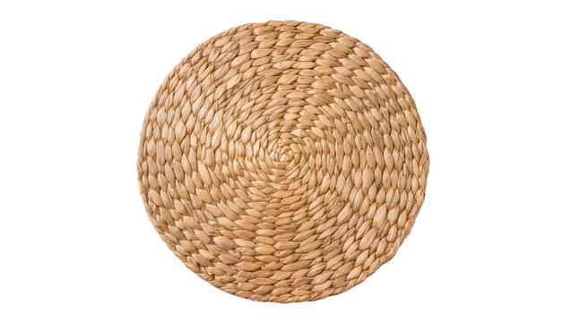 Round woven straw placemat with intricate spiral pattern, isolated on transparent background