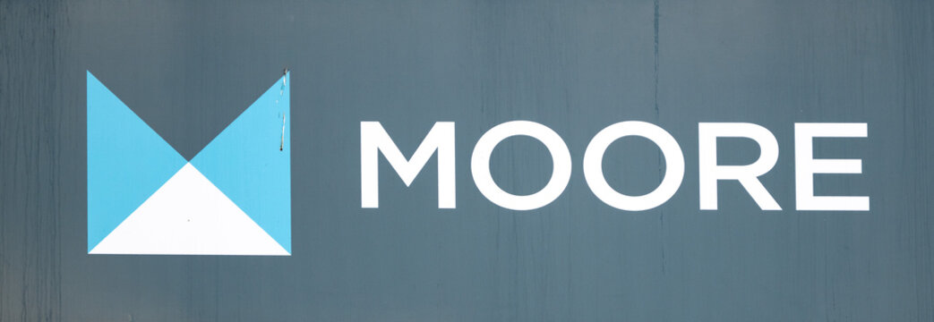 Moore company logo on office building in Brussels