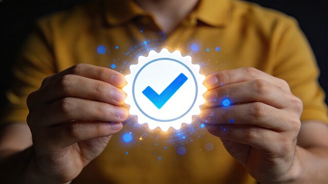Man holding a glowing digital badge with a blue checkmark symbolizing approval success verification and certification in a modern business concept