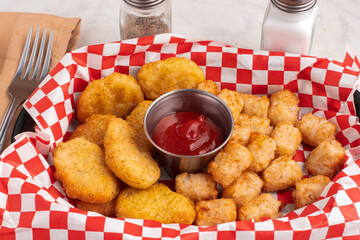chicken nuggets with a side of  tater tots