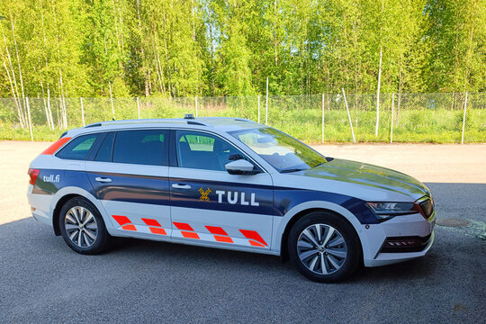 A white Skoda Superb station wagon, a Finnish Customs vehicle (Tulli), is parked on a paved area on May 27, 2025 in J&auml;rvenp&auml;&auml;, Finland