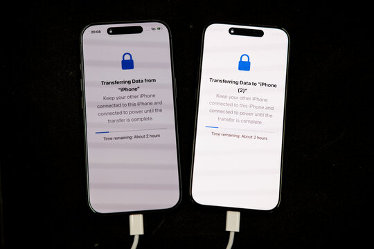 Bangkok, Thailand - April 3, 2026 : Data transferring from old iPhone to New iPhone 17 vid usb type c.