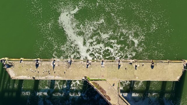 Aerial view of the Anglian Water Cliff Quay WRC, where the structure meets the water, creating a striking contrast of textures and tones, Ipswich, England, United Kingdom.