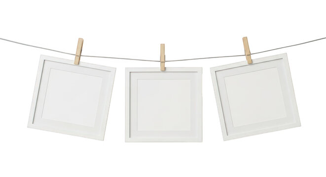 Minimalist white picture frames hanging on clothesline, set of 3 square photo mockups with wooden clothespins, clean gallery display template isolated on Transparent Background