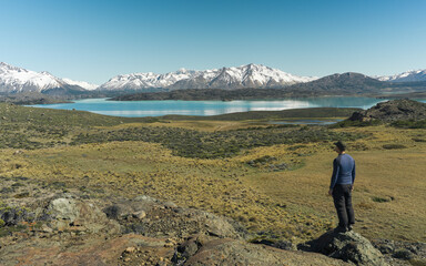 Fototapeta premium Man hiker looking at mountain lake landscape in Patagonia in Perito Moreno National Park Argentina