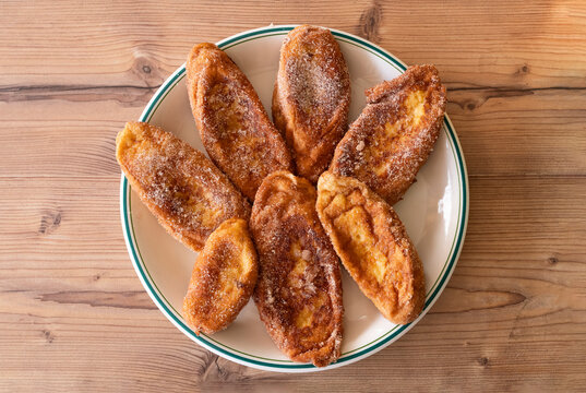 Homemade Spanish Torrijas on Rustic Wooden Table, Traditional Easter Dessert, Top View, Sweet Breakfast Pastry