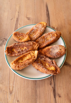 Vertical View of Homemade Spanish Torrijas on Rustic Table, Easter Treat, Home Baking and Pastry Recipe