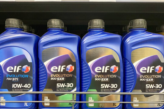 Kyiv, Ukraine, September 24, 2023: - Elf engine oil in blue plastic bottles, showing evolution 10w 40 and 5w 30 varieties for vehicle maintenance shop.