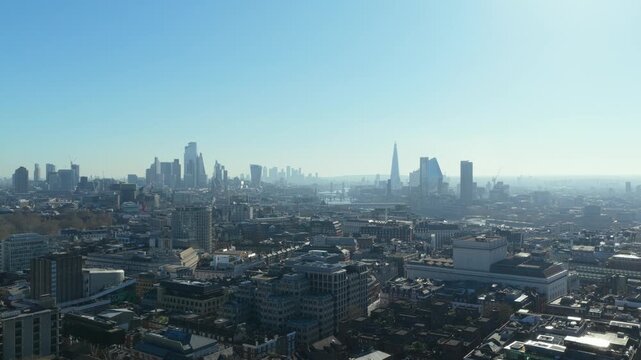 Aerial survey ove London, with financial district and The Shard background on a sunny day with clear sky in the United Kingdom