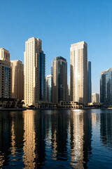 Obraz premium Dubai Marina Skyscrapers with Water Reflection