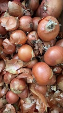 selective focus heap of fresh onions close-up view