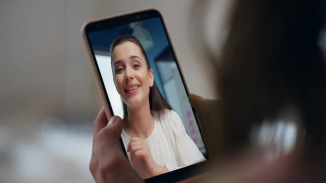 Lady talking smartphone conference online at home closeup. Colleagues speaking