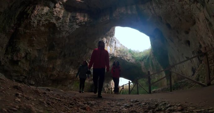 Exploring Devetashka Cave: Adventurers Emerge into Bulgaria's Light