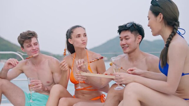 Summer yatching relax happy wellness group friend sharing grilled food and drink on yacht deck together carefree holiday travel vacation with joyful ocean mountain view leisurely barbecue bonding