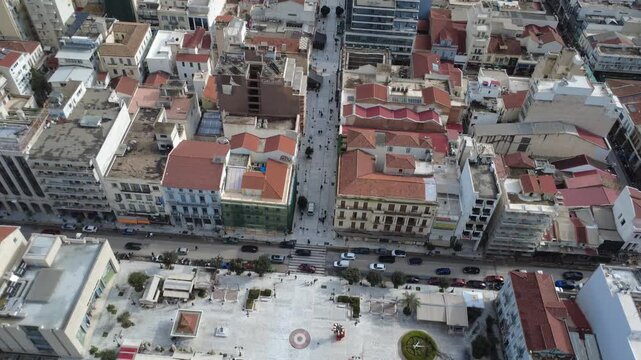 Aerial view of historic city center with red roofs and dense urban grid