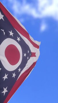 Close Up of Ohio State Flag Waving Against Bright Blue Sky