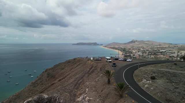 Aerial drone view over Vila Baleira, a small town in Porto Santo island, Madeira, Portugal. Long golden beach with transprent water.