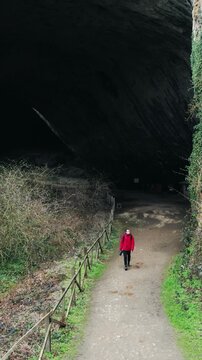 Explorer Enters Devetashka Cave: Bulgaria's Natural Wonder
