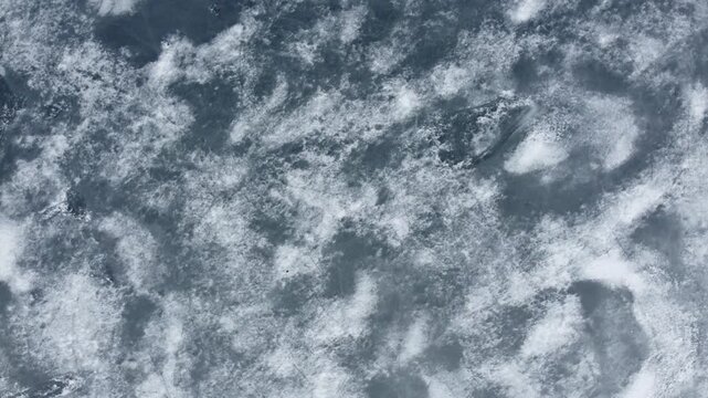 Ice surface showing patterns and textures in a cold location during winter