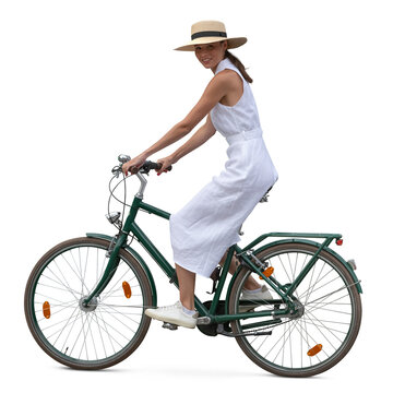 Woman in a white dress and wearing a hat riding a bicycle seen from side view, isolated on white and transparent background