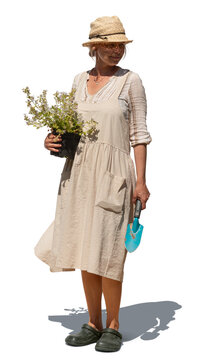 Woman with a gardening apron standing and holding plants and planting tools in her hand, isolated on transparent and white background