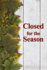 Closed for the season message with autumn leaves
