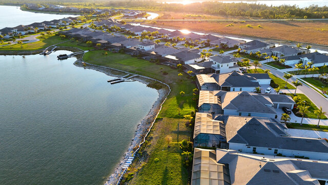 Fort Myers, Florida luxury housing neighborhood aerial drone still photo during gorgeous sunset.