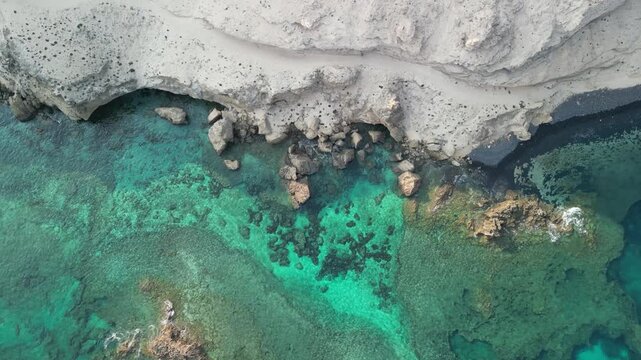 Aerial drone view of stunning volcanic landscape in Porto Santo island, Madeira, Portugal. Old volcano and high mountains with natural beaches