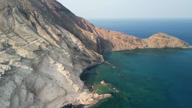 Aerial drone view of stunning volcanic landscape in Porto Santo island, Madeira, Portugal. Old volcano and high mountains with natural beaches