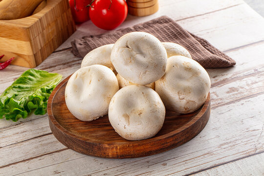 Raw white champignon mush heap