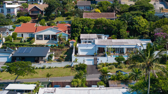 Aerial view of Ballito coastal residential area with ocean and tropical houses, South Africa
