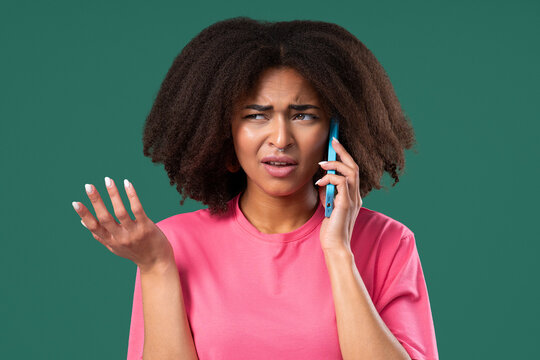 Annoyed Young African Woman Quarreling Talking On Mobile Phone. Angry Lady