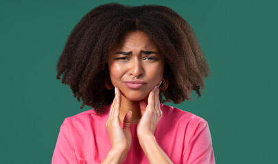 Fototapeta premium Young Teen Girl With Tooth Pain, green Background. Toothache, Dental Problem