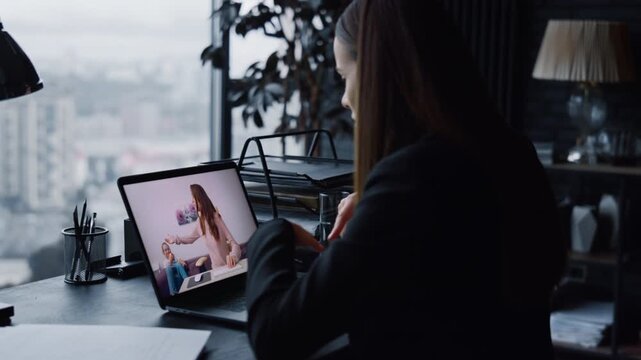 Woman speaking web chat using laptop in office closeup. Lady boss video calling