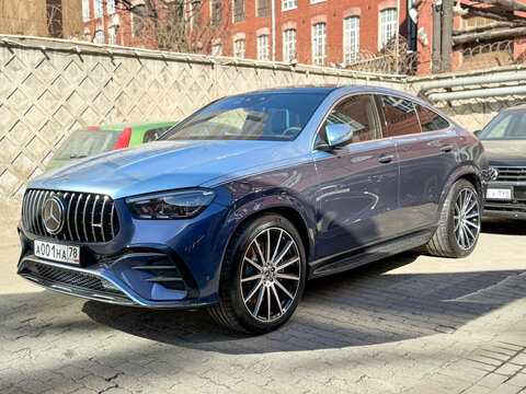 Blue Mercedes-Benz GLE Coupe AMG 63 AMG S parked on street. Exterior of a blue SUV car Mercedes-Benz GLE 63S parking lot in the city street. Germany premium SUV car. Mercedes-Maybach. 