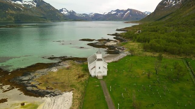 Aerial images of Iglesia de Gims&oslash;y (Gims&oslash;y kirke) in Lofoten, Norway, during a sunny day, 4k 30 fps, drone video
