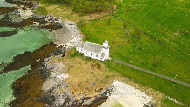 Aerial images of Iglesia de Gims&oslash;y (Gims&oslash;y kirke) in Lofoten, Norway, during a sunny day, 4k 30 fps, drone video