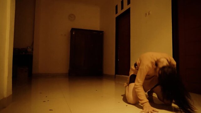 Desperate Woman's Emotional Breakdown and Dance in a Dark Hallway
