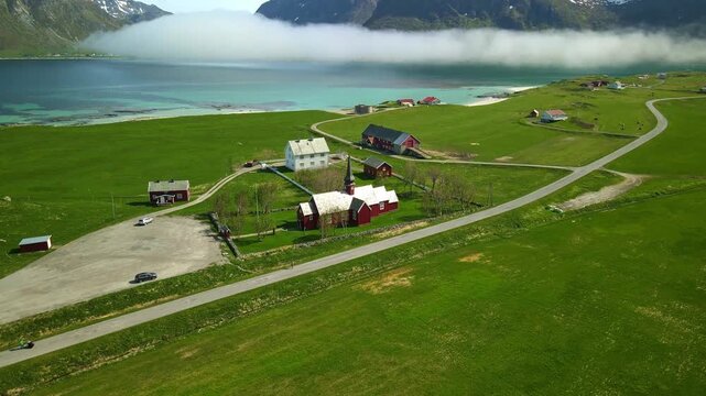Aerial footage of Flakstad in Lofoten, Norway, during a sunny day