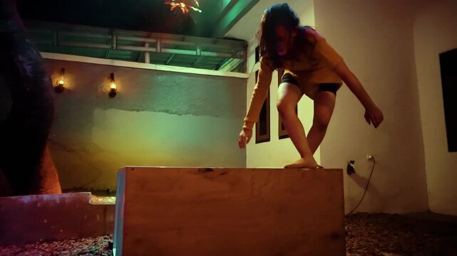 Woman Walking a Tightrope on a Box in a Tense Performance