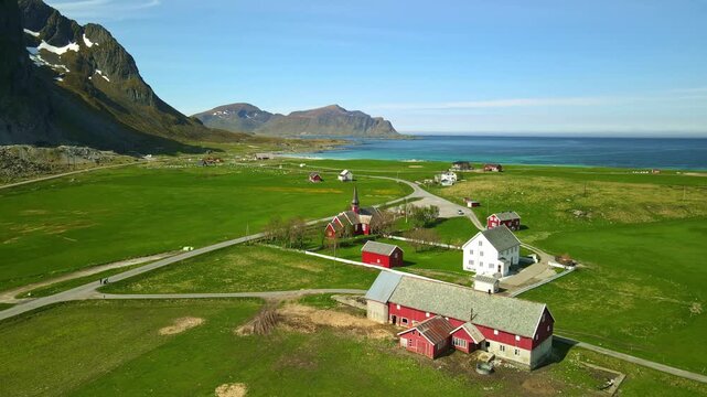 Aerial footage of Flakstad in Lofoten, Norway, during a sunny day