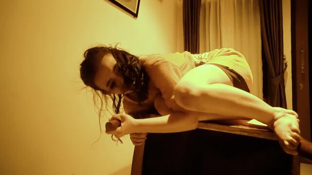 Woman's Pained and Contorted Dance with an Overturned Chair
