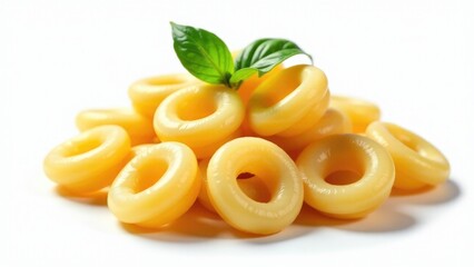 A plate of pasta with a single leaf placed on top, suitable for food or nature photography