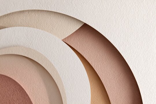 Abstract layered paper art with neutral tones and textured surfaces