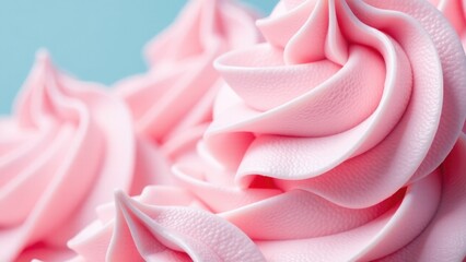 A close-up view of a pink frosted cupcake, perfect for baking or food photography