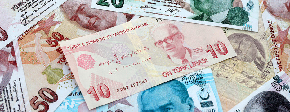 Turkish lira money banknotes pile on table. Turkey bills of TRY currency. Concept of economy