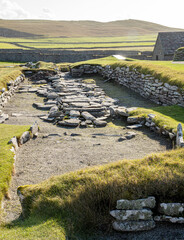 A view of the outline of a Viking Long House in the ancient settlement of Jarlshof on the island of Mainland Shetland © Drew