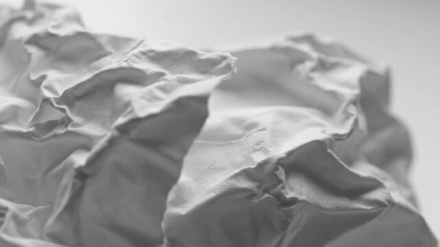 Close-up of crumpled white tissue paper texture, sound of paper being crumbled and manipulated