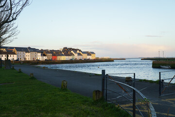 Fototapeta premium Night landscape of Galway city buildings reflecting in Corrib river water at twilight 